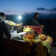Mar. 1, 2016 – Idomeni, Greece. A fruit seller sets up shop.